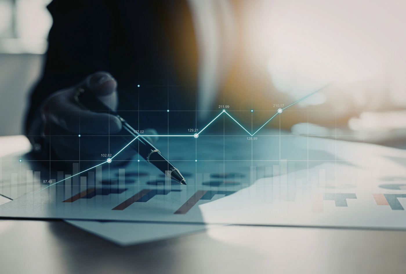 Manufacturing leader stressed while comparing conflicting spreadsheet and ERP production reports on the factory floor