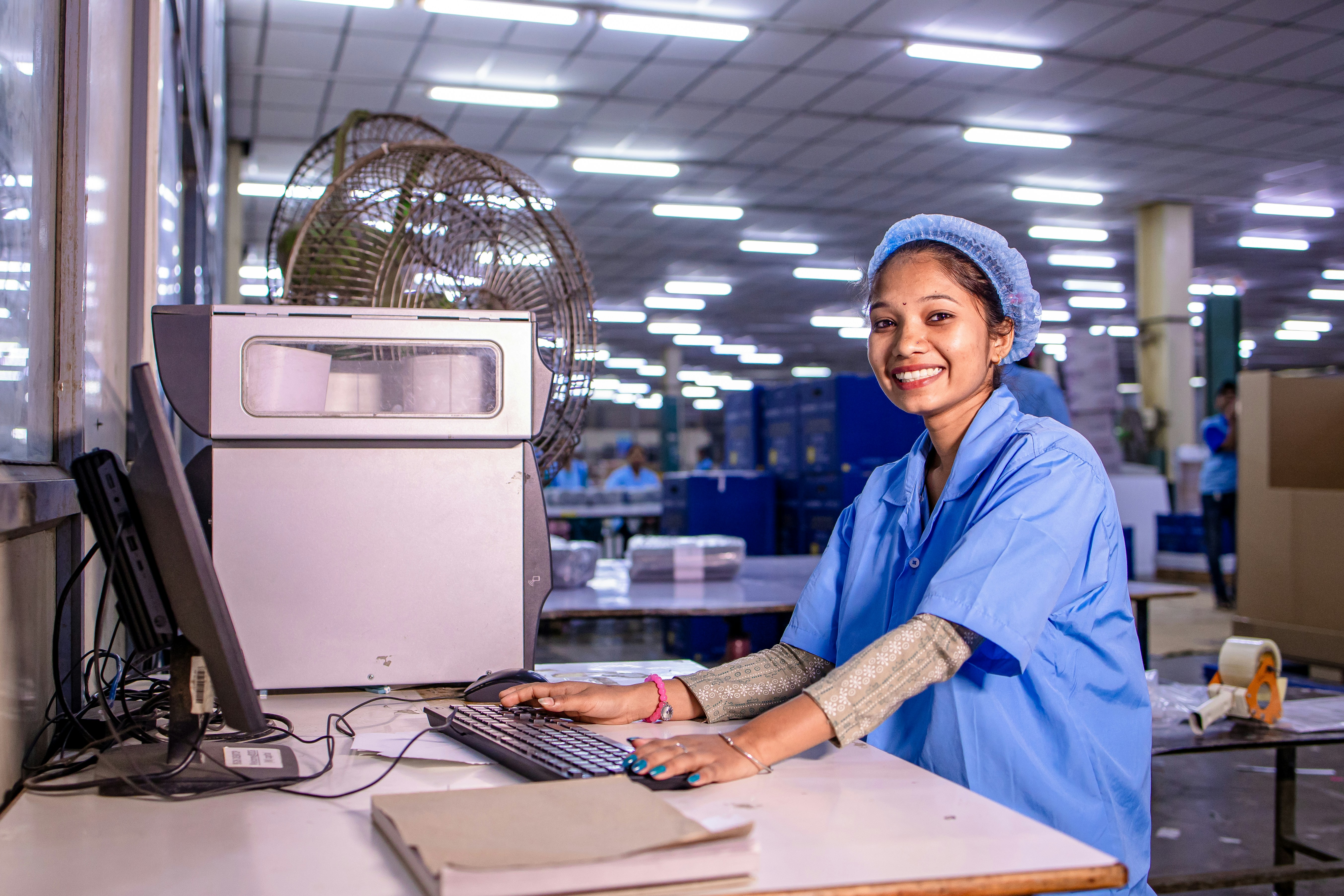 Manufacturing floor worker grinding metal